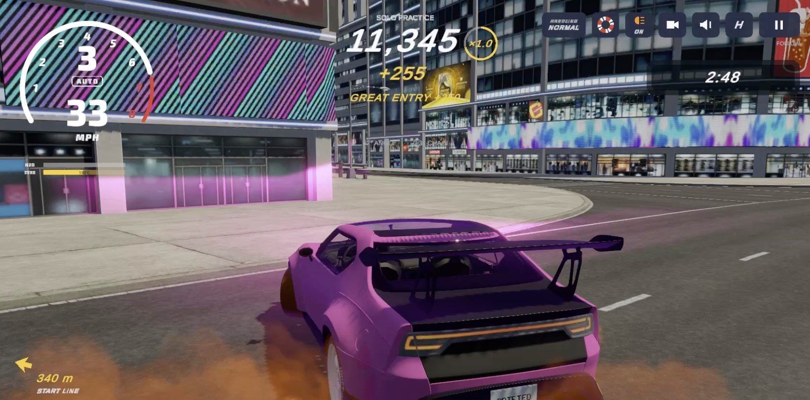 A purple drift car turning past neon-lit city buildings at night